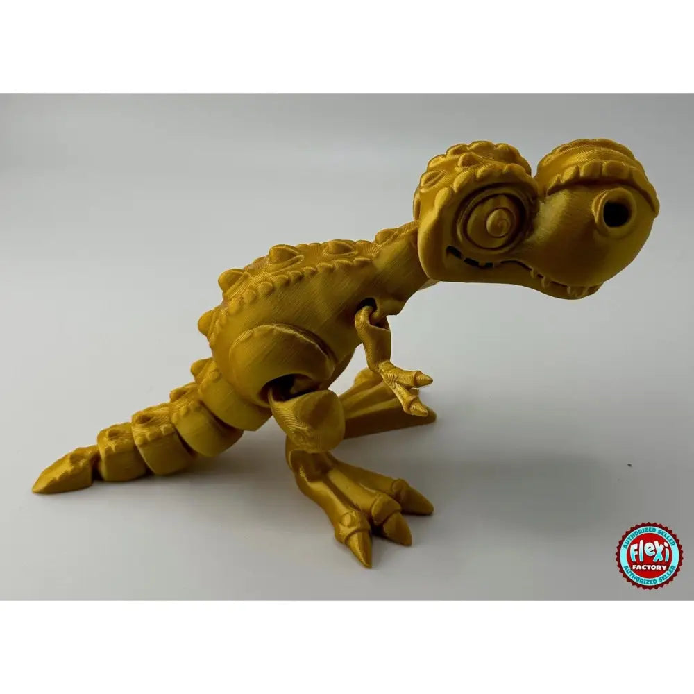 Golden articulated dinosaur toy.