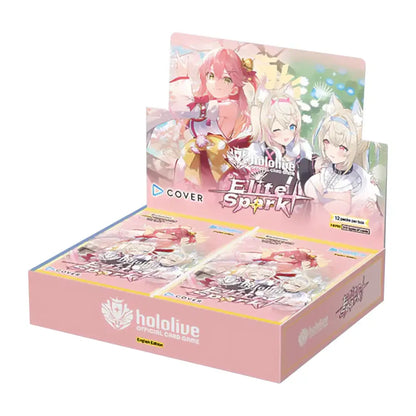 Pink cardboard display box for the hololive elite spark official card game, featuring anime-style artwork of three characters on its front and side panels.