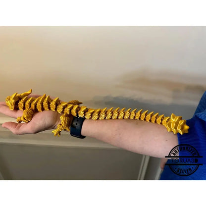 Golden articulated dragon toy.