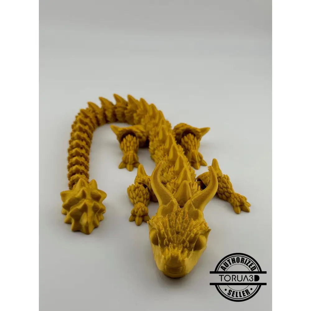 Golden articulated dragon figurine.