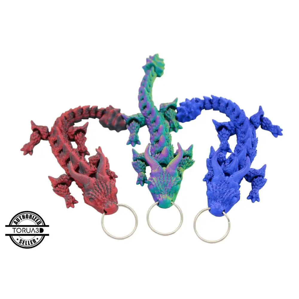 Three colorful dragon keychains.