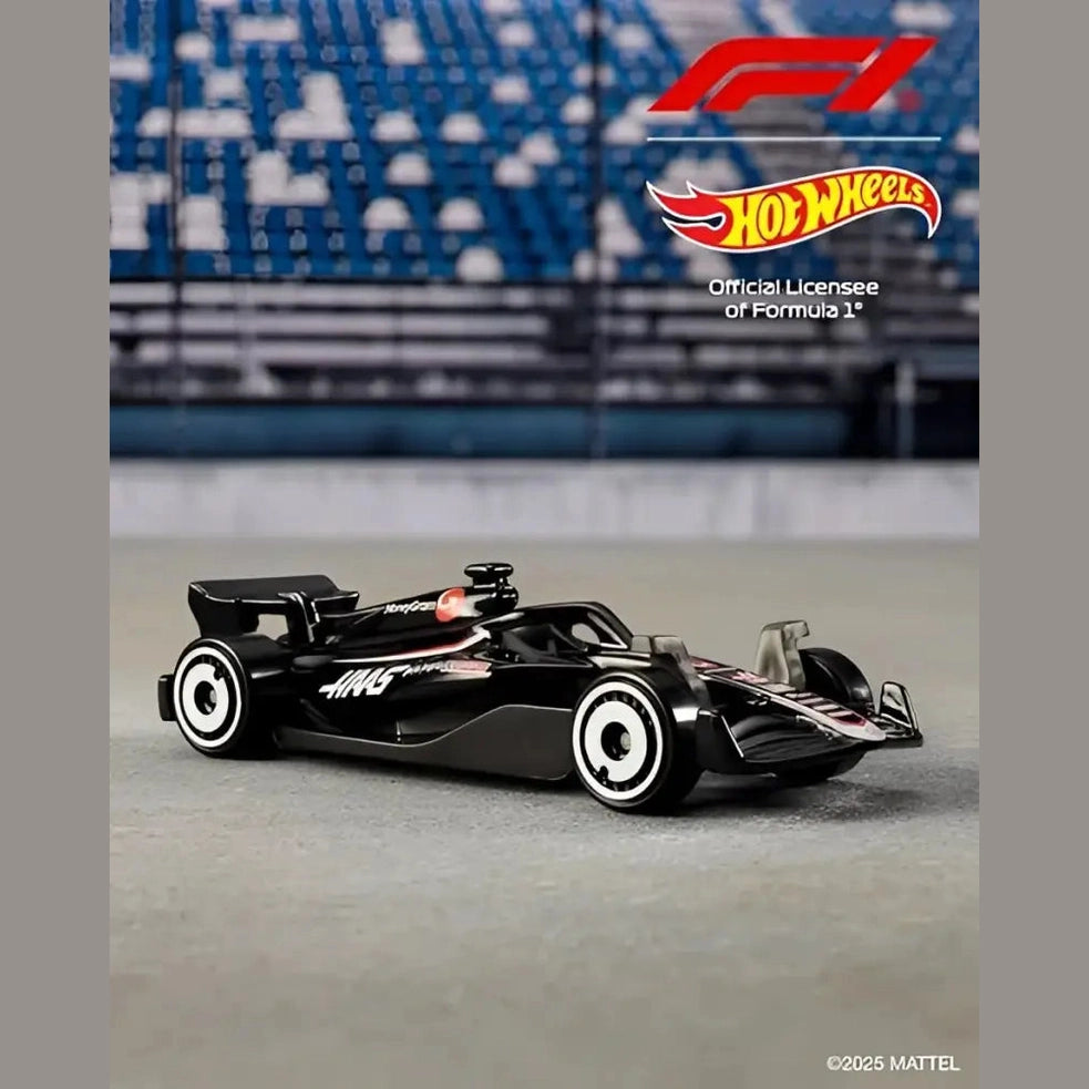 A black toy Formula 1 race car with white wheels.
