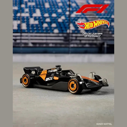 Black and orange Hot Wheels Formula 1 race car toy.