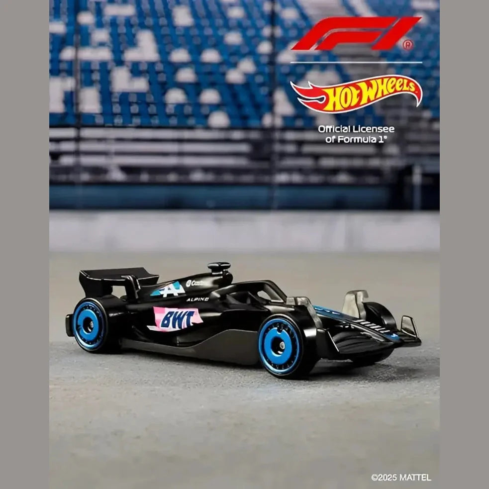 Black Hot Wheels Alpine F1 car with blue wheels and pink accents.
