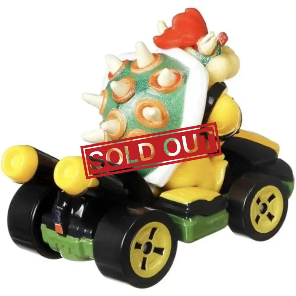 Bowser in a black and green Mario Kart with yellow wheels and headlights.