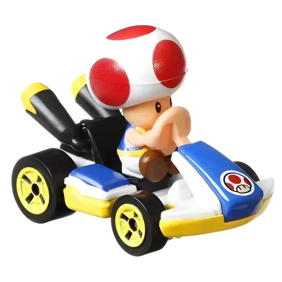 A Toad character from Mario Kart in a blue, white, and yellow racing kart.