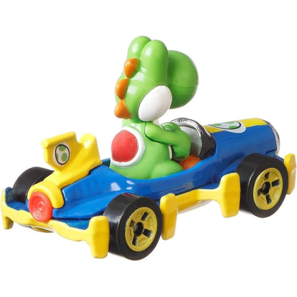 Green dinosaur toy in a blue and yellow racing car, likely from nintendo’s mario kart series.