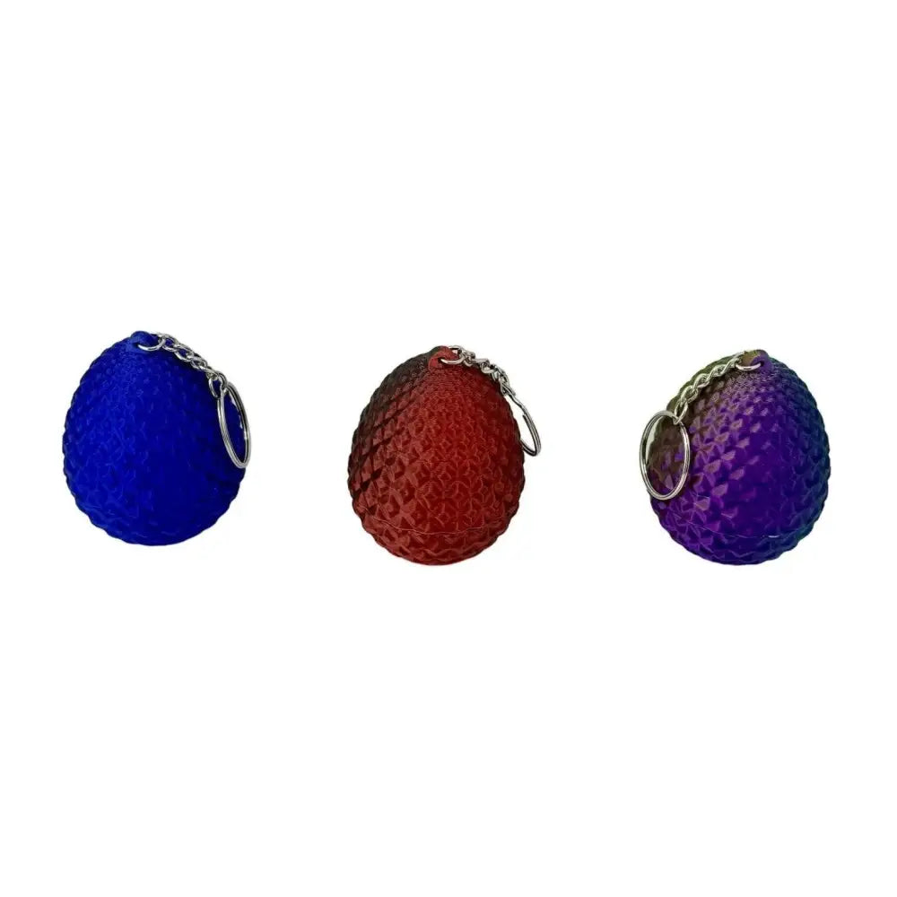 Three dragon egg keychains.