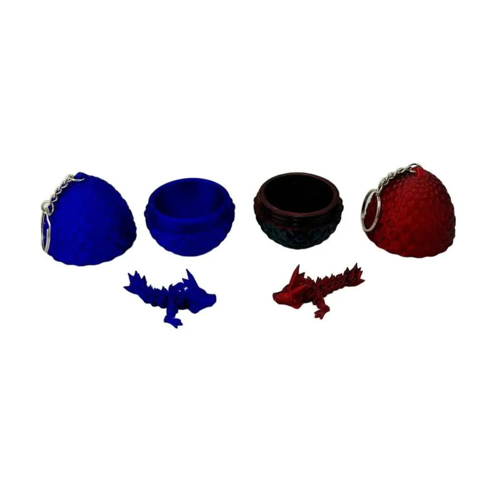 Two dragon egg keychains with matching dragon figurines.