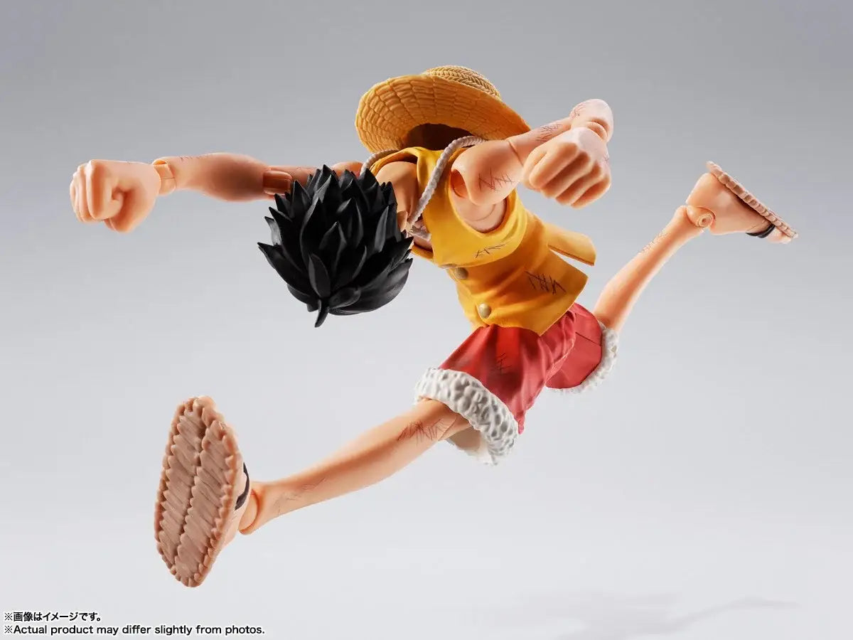 Monkey D Luffy Marineford figuarts action figure wearing orange straw hat yellow shirt red shorts and tan sandals