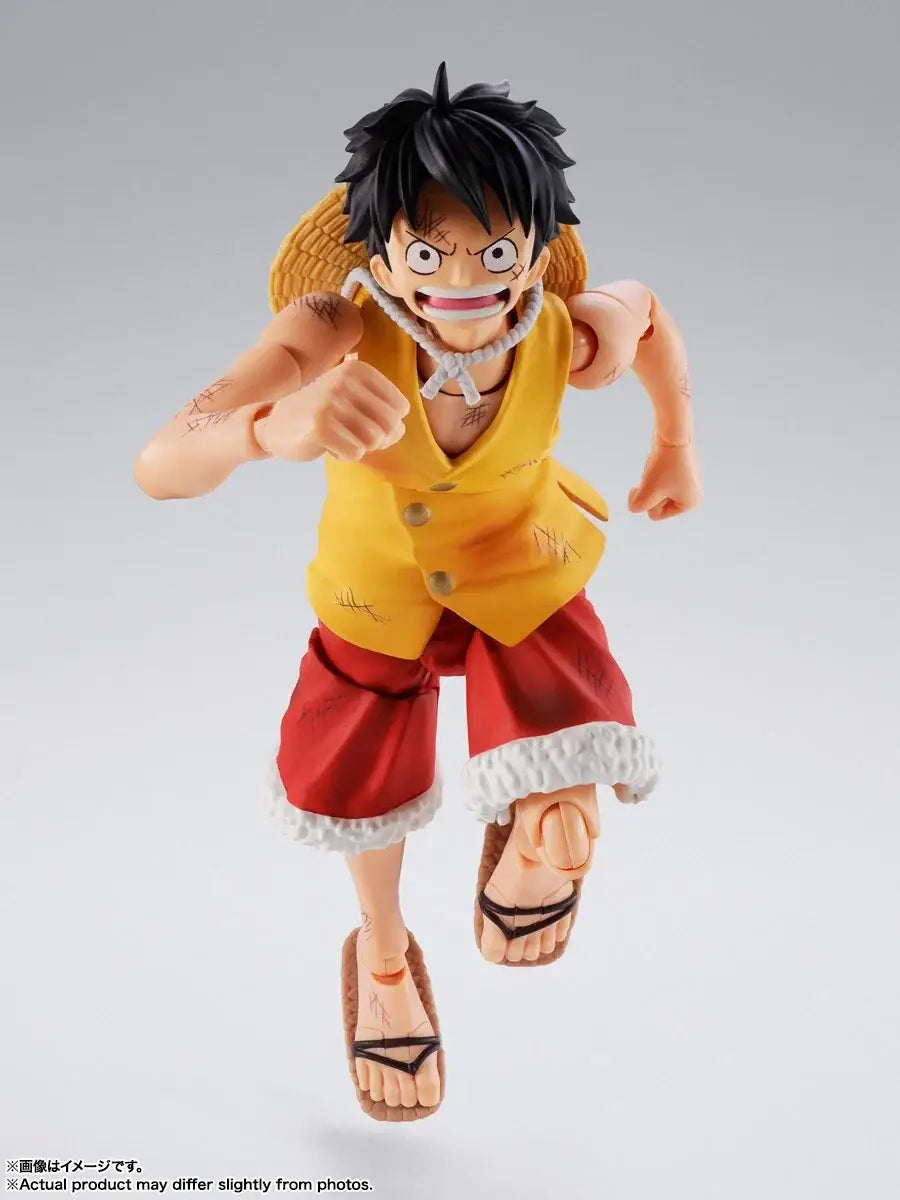 Monkey d luffy marineford figuarts action figure in yellow and red with black hair, straw hat, and sandals