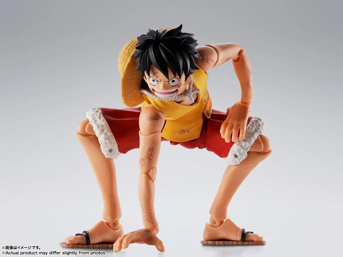 Monkey D Luffy marineford figuarts action figure in yellow and red with black hair straw hat and detailed articulation