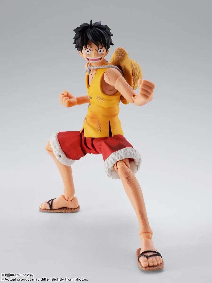 Monkey D Luffy marineford figuarts action figure with yellow and red outfit black hair straw hat and detailed fabric textures