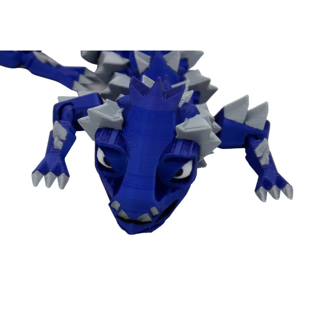 Blue and gray articulated dragon toy.