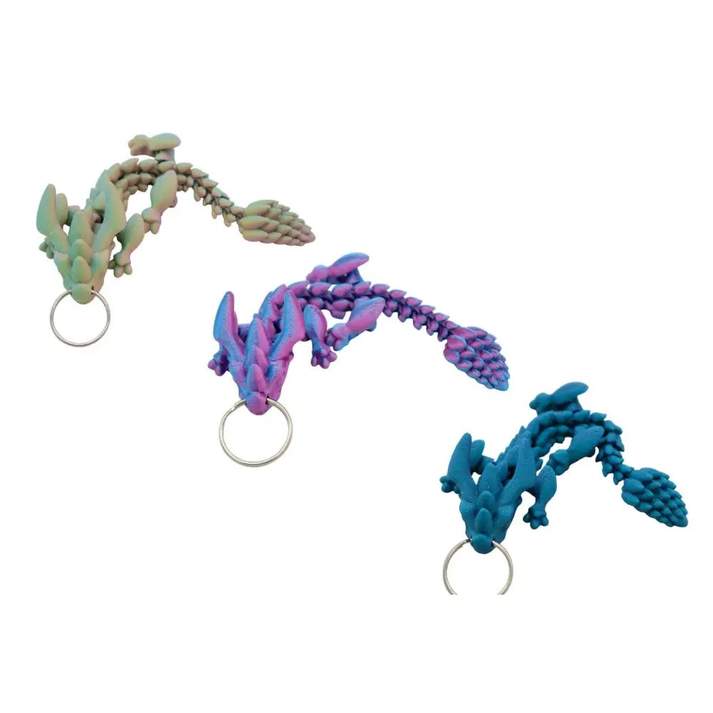 Three colorful dragon keychains.