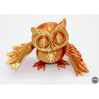 Golden 3D-printed owl figurine.