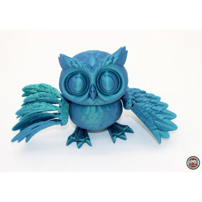 Blue 3D-printed owl figurine.