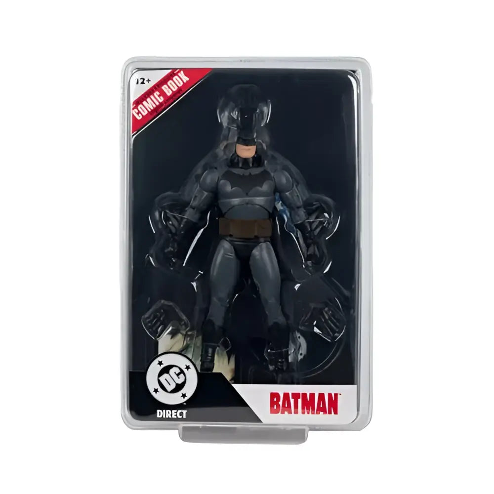 Batman action figure in black and gray suit with brown belt packaged in clear plastic from McFarlane toys page punchers wave