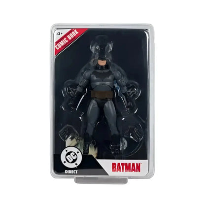 Batman action figure in black and gray suit with brown belt packaged in clear plastic from McFarlane toys page punchers wave