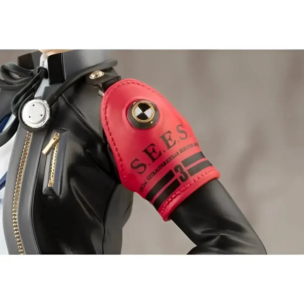 Persona 3 reload the protagonist artfx j statue features a red leather arm patch with black stripes and a metallic emblem