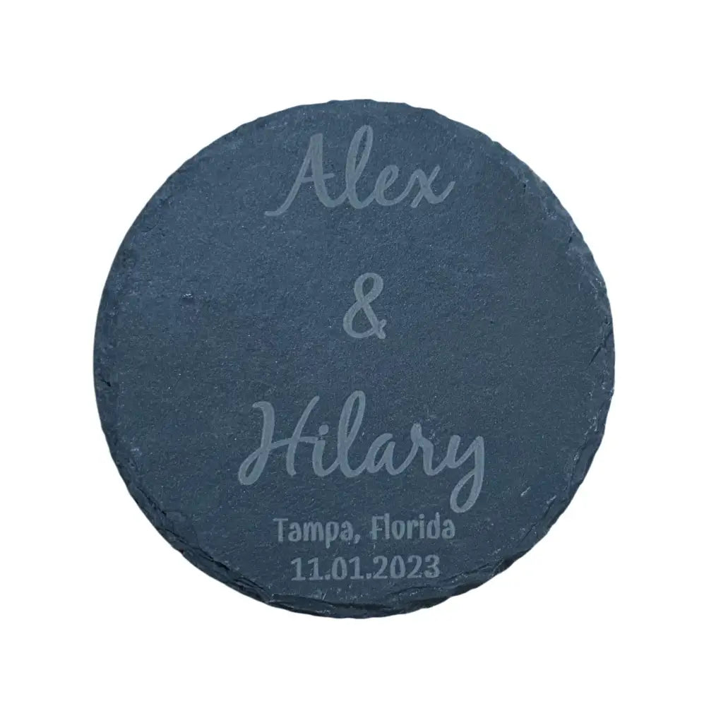 Round slate coaster with engraved names and date.