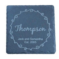 Engraved slate coaster with a decorative border.