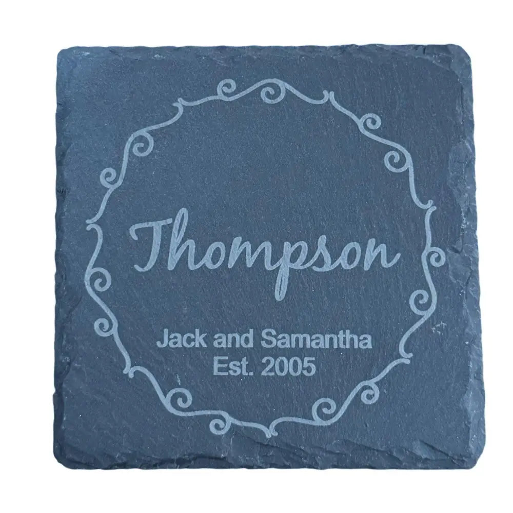 Engraved slate coaster with a decorative border.