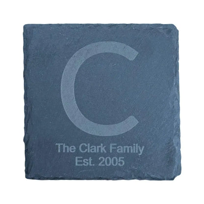 Square slate coaster with an etched initial and text.