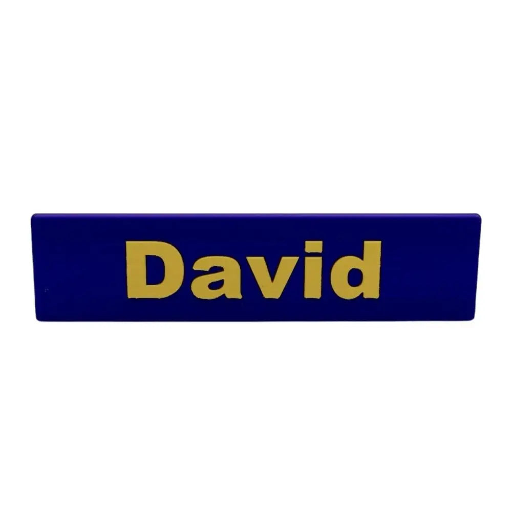 Blue nameplate with gold lettering.