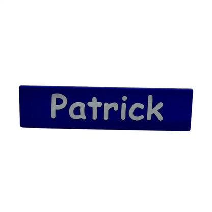 Blue nameplate with ’Patrick’ in silver.