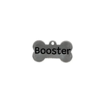 Dog bone-shaped tag with ’Booster’ printed on it.