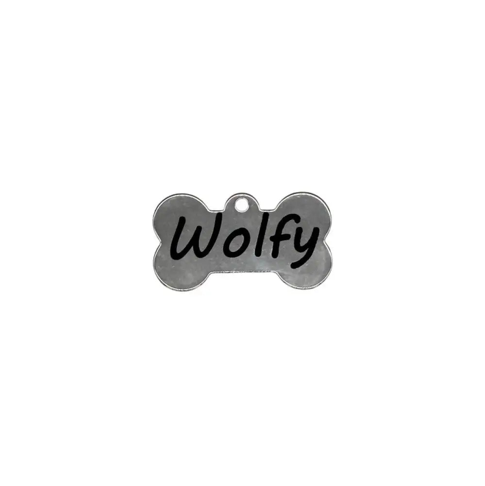 Dog bone tag with ’Wolfy’ written on it.