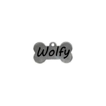 Dog bone tag with ’Wolfy’ written on it.
