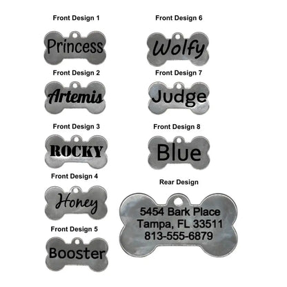 Dog bone-shaped pet tags with various names and address information.