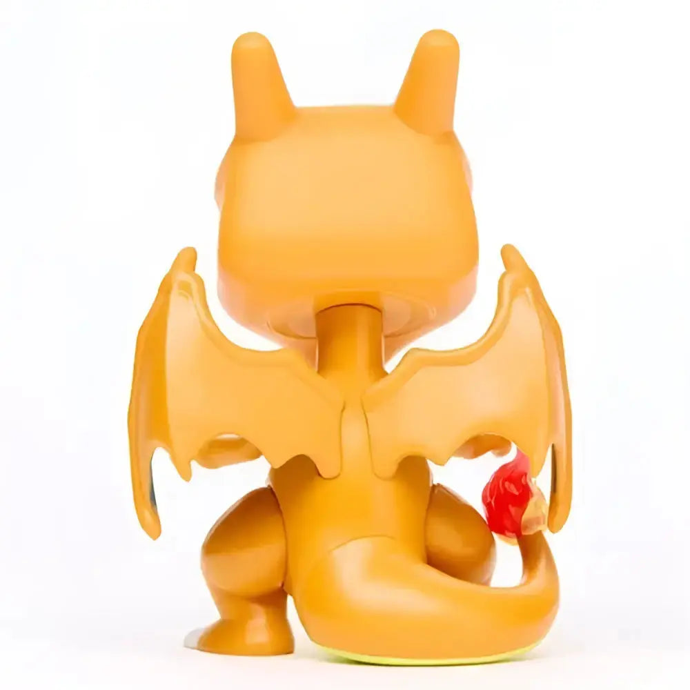 Orange plastic charizard funko pop vinyl figure with wings and red flame on tail collectible toy figure
