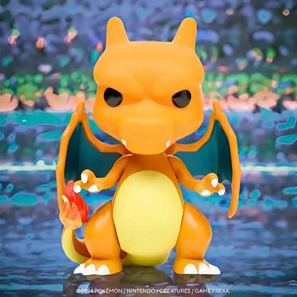 Pokemon charizard funko pop vinyl figure #843 orange and yellow with teal wings holding a red flame in its paw