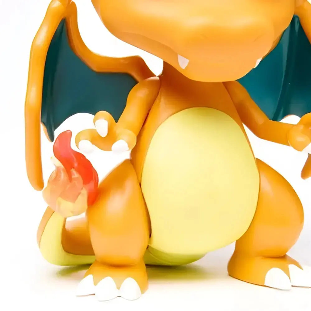 Orange and yellow charizard funko pop vinyl figure with teal wings white claws and red flame tail collectible toy