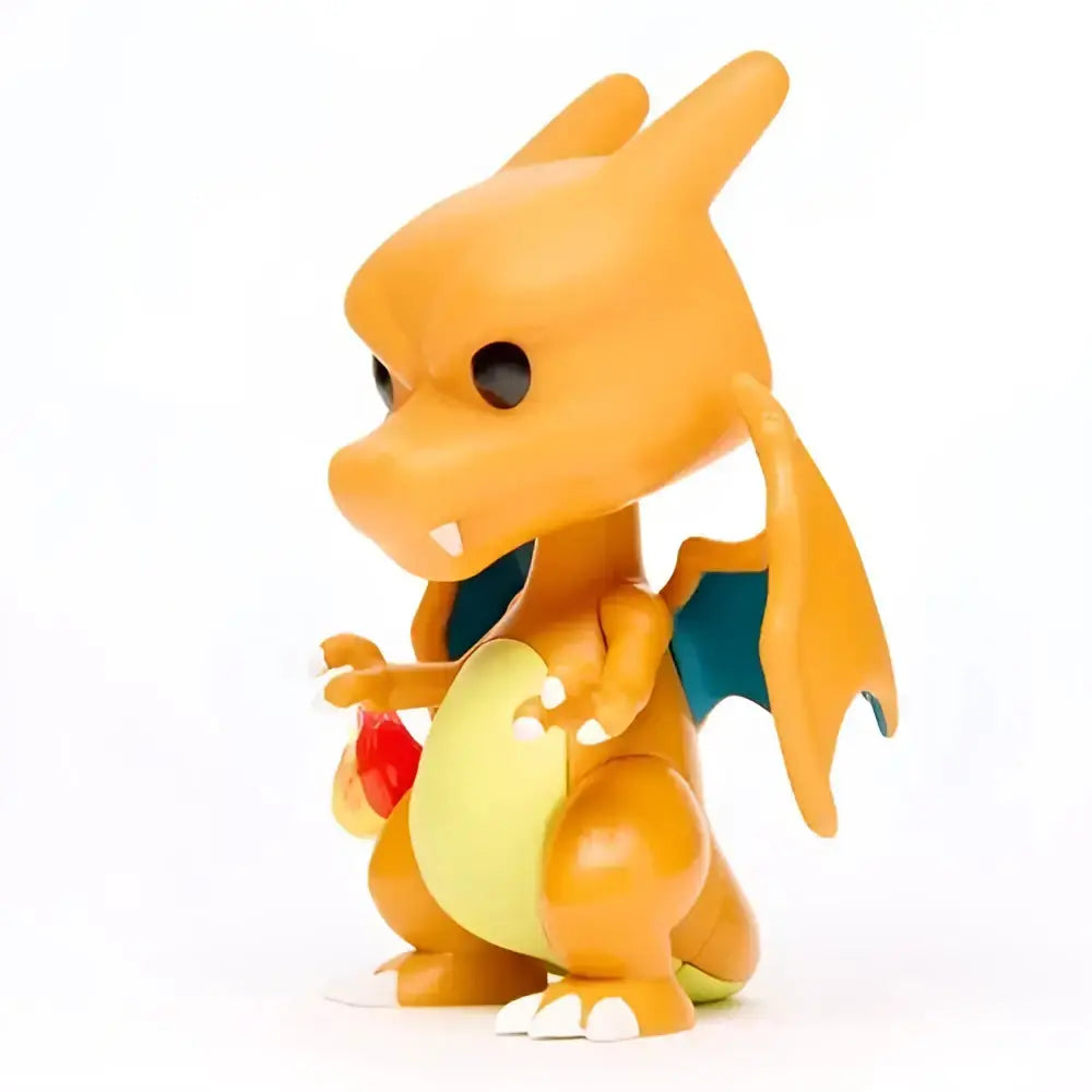 Orange and yellow plastic vinyl figure of baby charizard with teal wing accents pokemon charizard funko pop 843