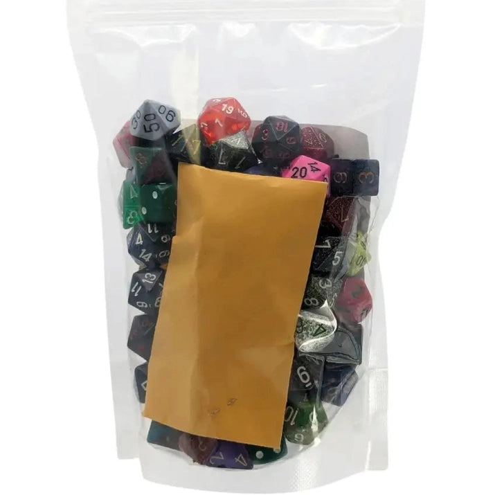 A clear plastic bag filled with assorted polyhedral dice and a small brown envelope.