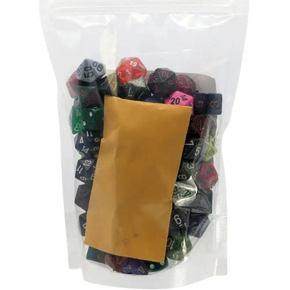 A clear plastic bag filled with assorted polyhedral dice and a small brown envelope.