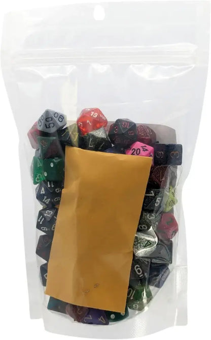 A clear plastic bag filled with assorted polyhedral dice and a small brown envelope.