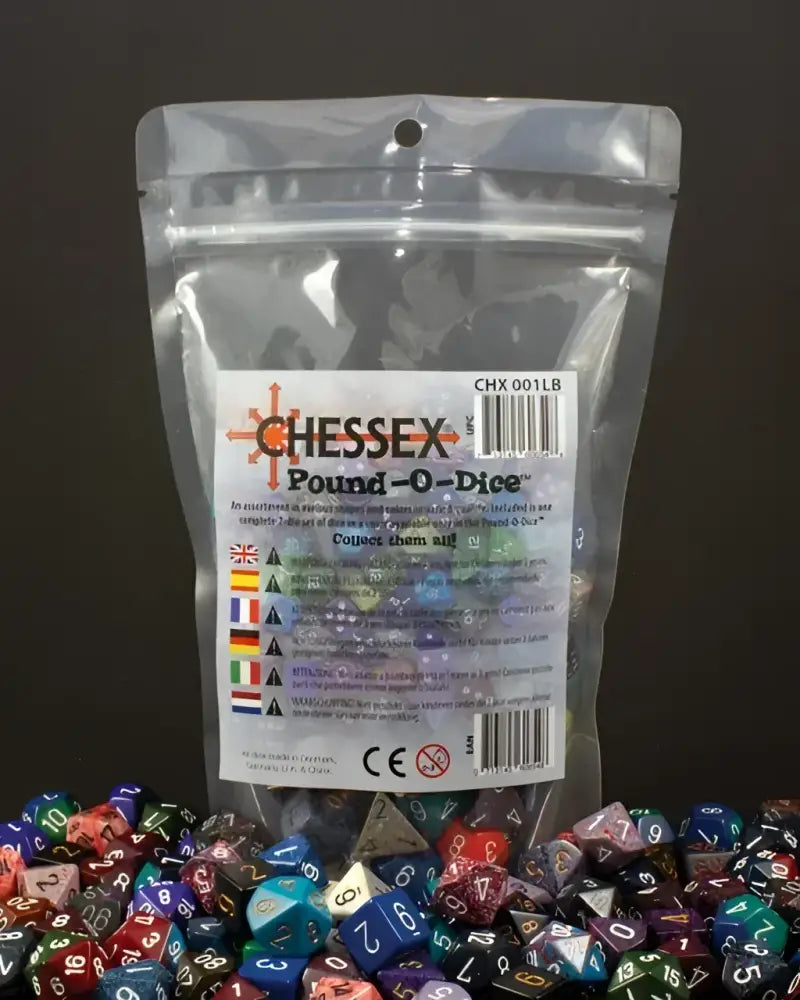 A clear plastic bag filled with assorted polyhedral dice, with many similar dice scattered around it.