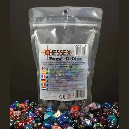 A clear plastic bag filled with assorted polyhedral dice, with many similar dice scattered around it.