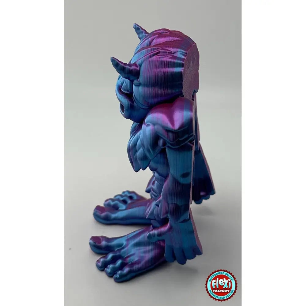 Iridescent blue and purple 3D printed troll figure.