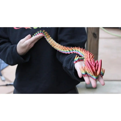 Rainbow-colored articulated dragon.