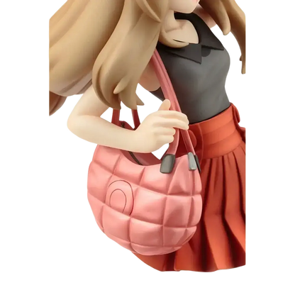 Pink quilted Serena handbag with silver-toned hardware featured alongside Fennekin ARTFX J statue