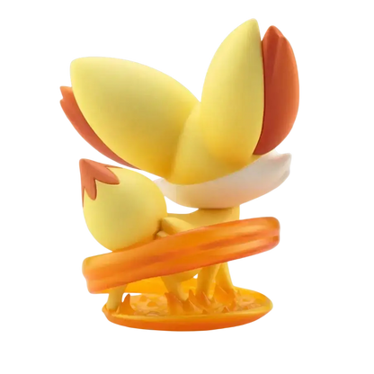 Serena fennekin artfx j statue featuring a yellow and orange figurine with flame-like tail tips on a matching base