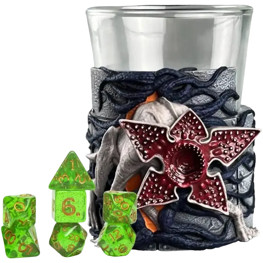The stranger things-themed glass holder features a detailed, textured gray and black design with an orange interior, showcasing the iconic red, star-shaped demogorgon head.