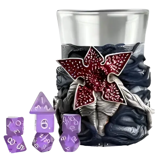Purple polyhedral dice set nestled in a textured, dark gray and red stranger things-themed cup.