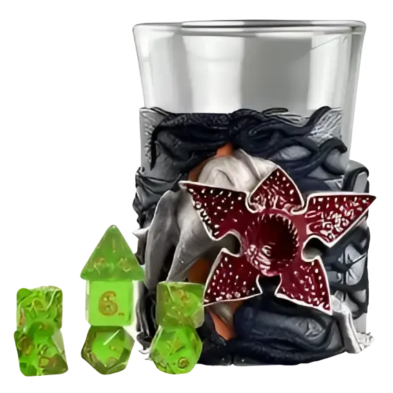 A translucent green polyhedral dice set with a red and black stranger things logo on the side of its glass holder.